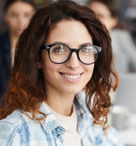 smiling-woman-in-business-meeting-8XM8MQA.jpg